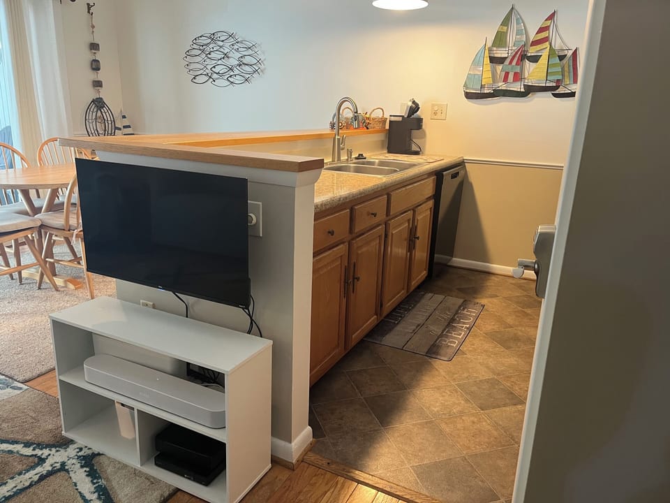 Kitchen area with dishwasher, Keurig machine
