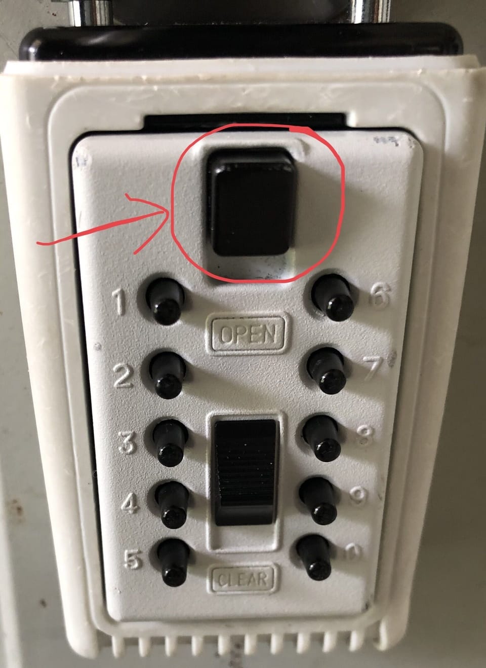 Keyless key holder.  Push the top button down after entering code to open box.