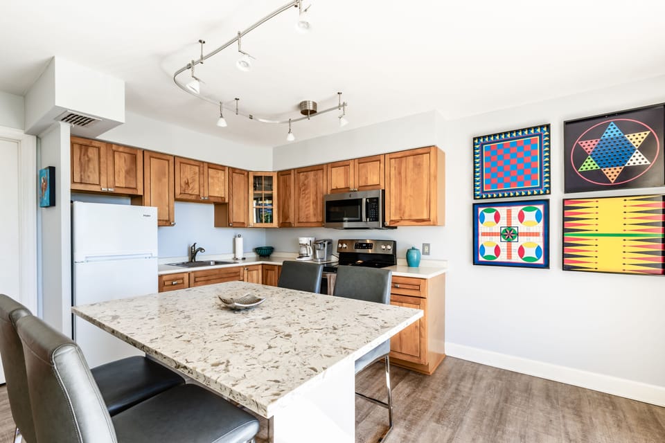 Fully Stocked Kitchen with comfortable counter height seating for 4. 