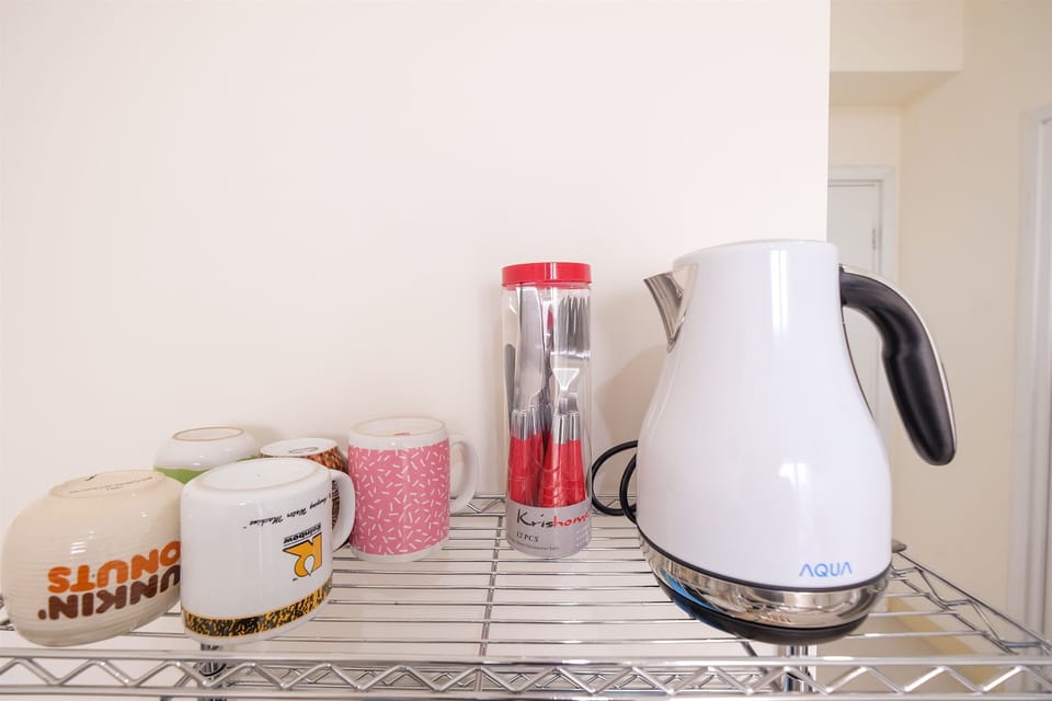 Apartment, 2 Bedrooms | Private kitchenette | Full-size fridge, stovetop, electric kettle, cookware/dishes/utensils