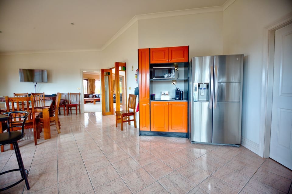 Large double door fridge/freezer inside the huge kitchen.  