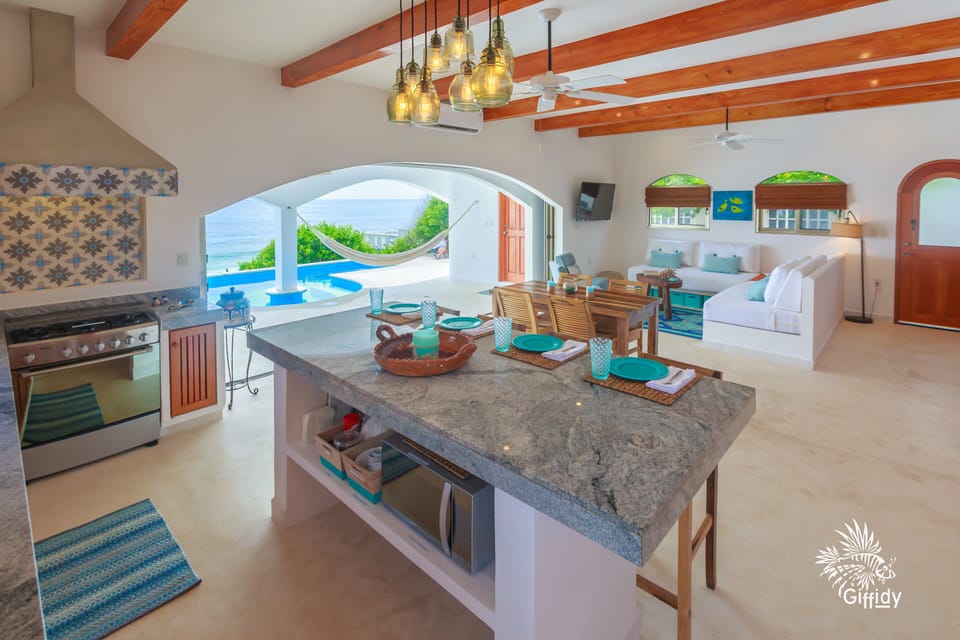 view from the kitchen island to the ocean; microwave & coffee maker in island