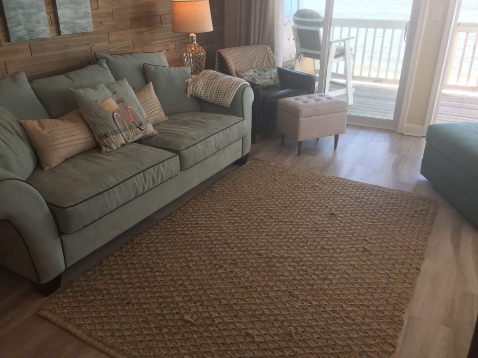 Another view showing deck area just off the living room with wall of glass doors