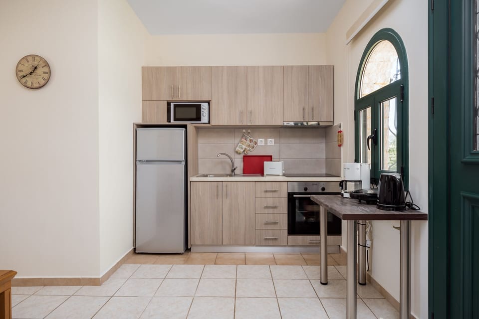 Luxury Villa, 1 Bedroom, Garden View (Gaia) | Private kitchen | Full-size fridge, microwave, oven, stovetop