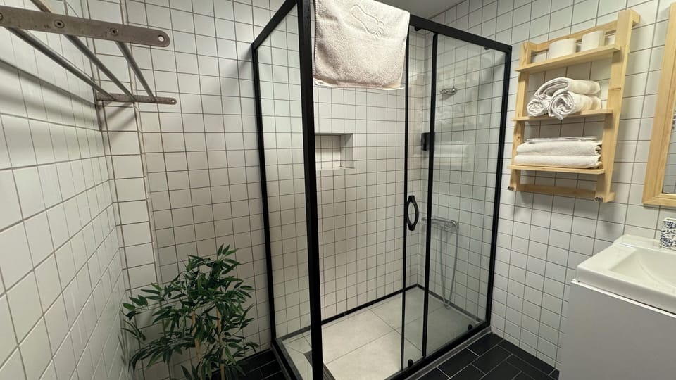 Superior Triple Room, Patio | Bathroom | Shower, rainfall showerhead, free toiletries, hair dryer