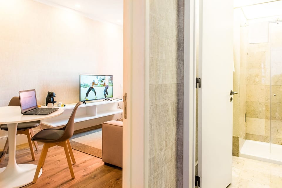 Suite, Patio, City View | Living area | Flat-screen TV