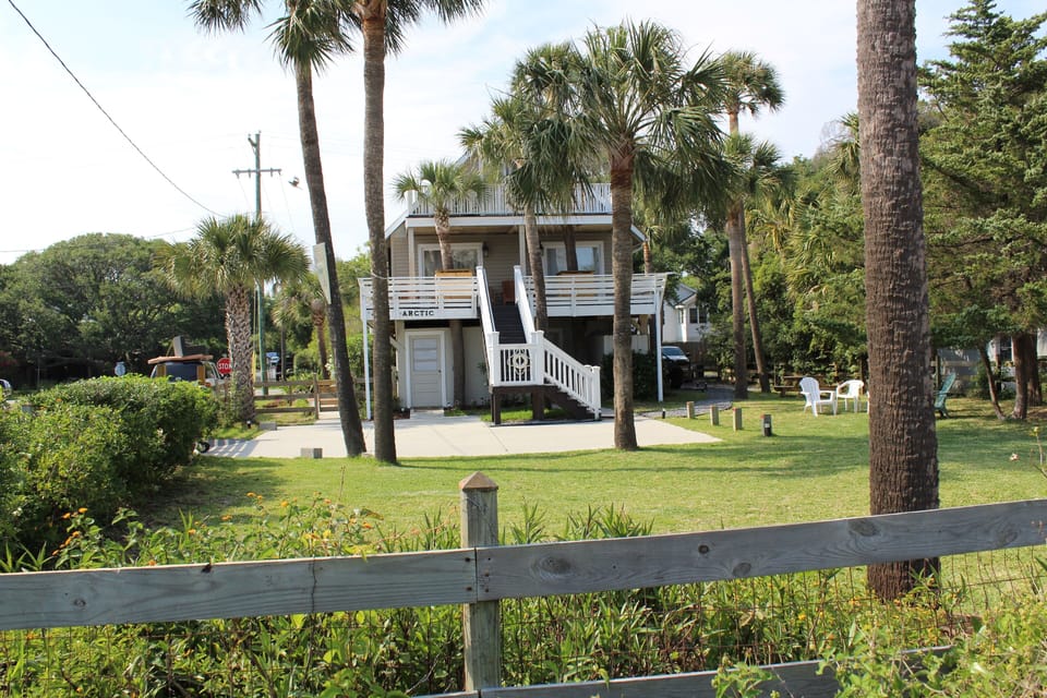 Large fenced yard and private driveway in front of house. Driveway gates close.