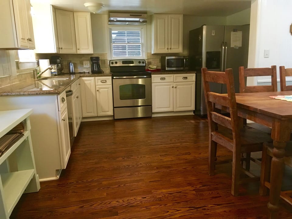 Updated kitchen with stainless appliances and granite counter tops.