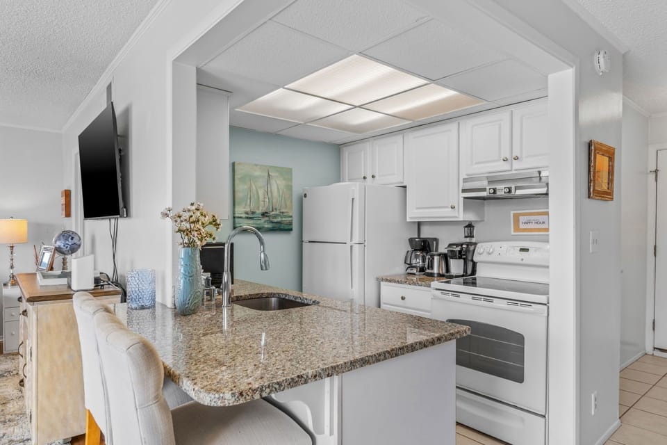 Cook with ease in your granite-topped kitchen, complete with modern appliances and breakfast bar seating for casual dining.