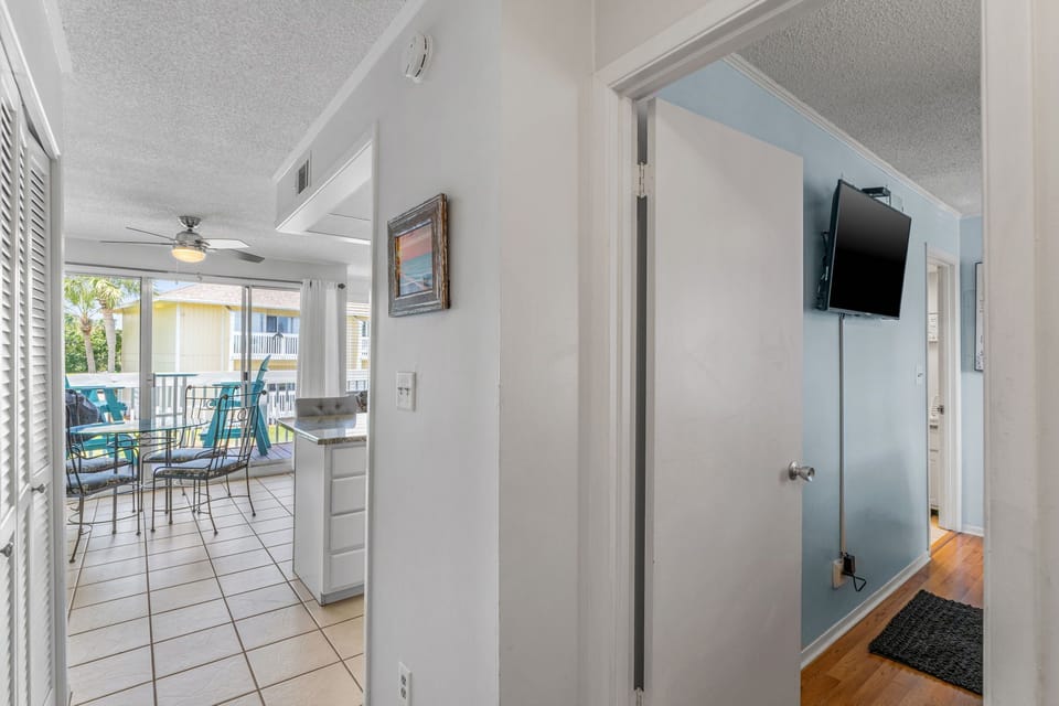 Step into your bright, open condo where coastal views await from your private balcony dining area.