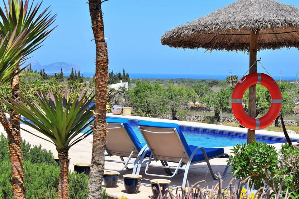 swimming pool with sunbeds and beautiful views