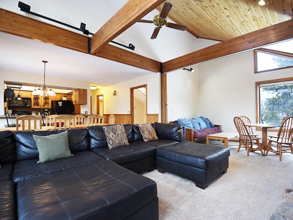 Stretch out on plush leather seating beneath soaring wood beams and cathedral ceilings in your spacious great room.