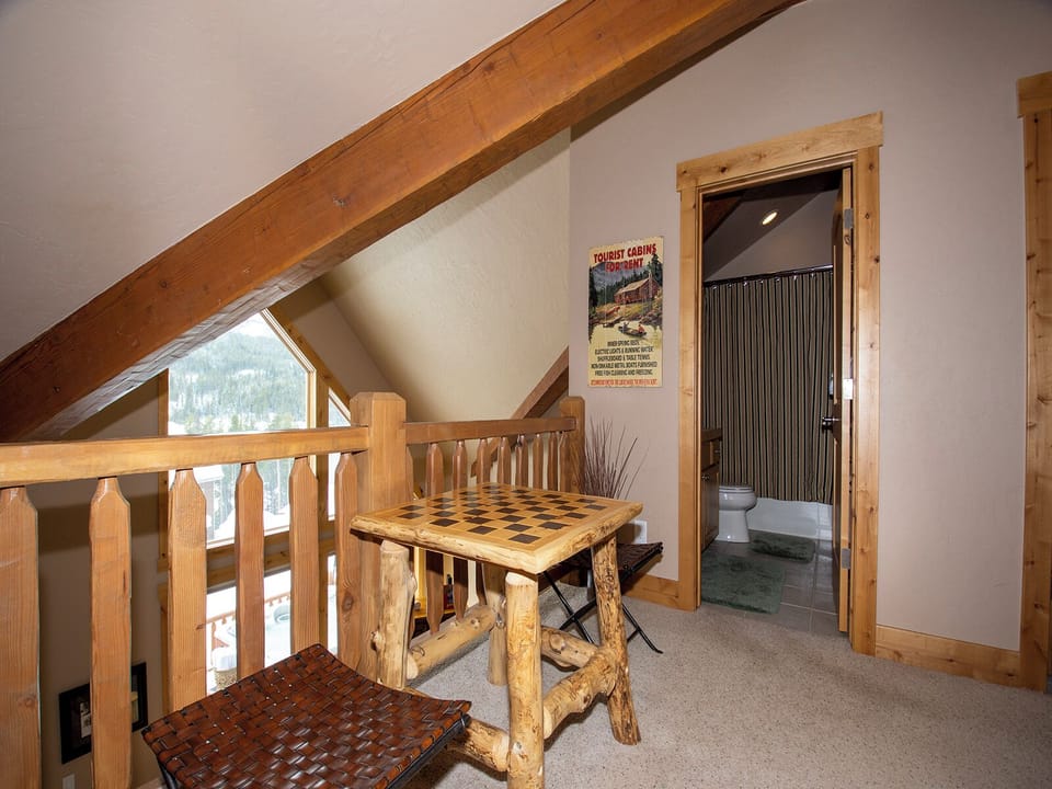 Your private game corner awaits beneath rustic wood beams, where you can challenge friends to chess by the window.