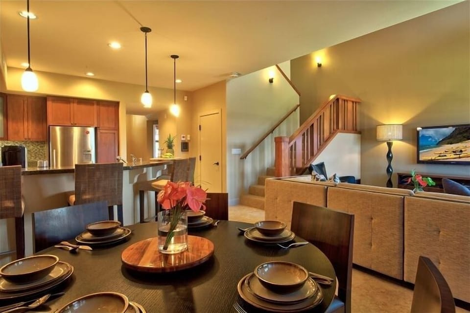 Open design kitchen with richly coloured milo wood cabinets.
