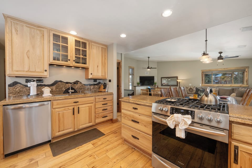 Your fully equipped kitchen features beautiful wood cabinetry, granite countertops, and quality appliances, perfect for preparing meals during your stay.