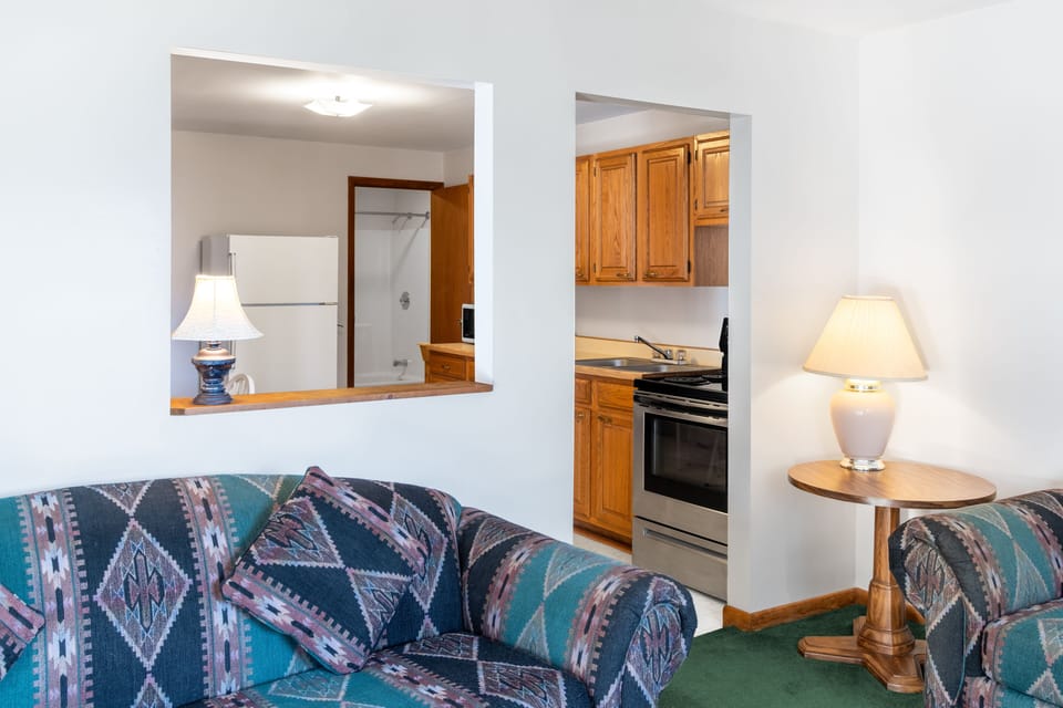 Suite, 1 Bedroom, 1 Living Room | Living room | 55-inch Smart TV with cable channels, TV, Hulu
