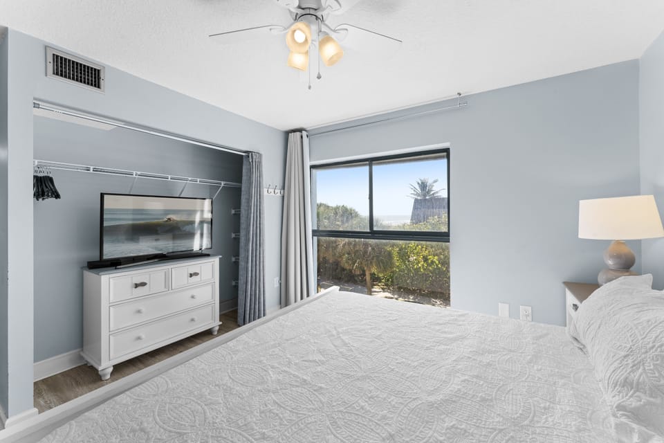 Rest easy in this charming bedroom with a beautiful window view