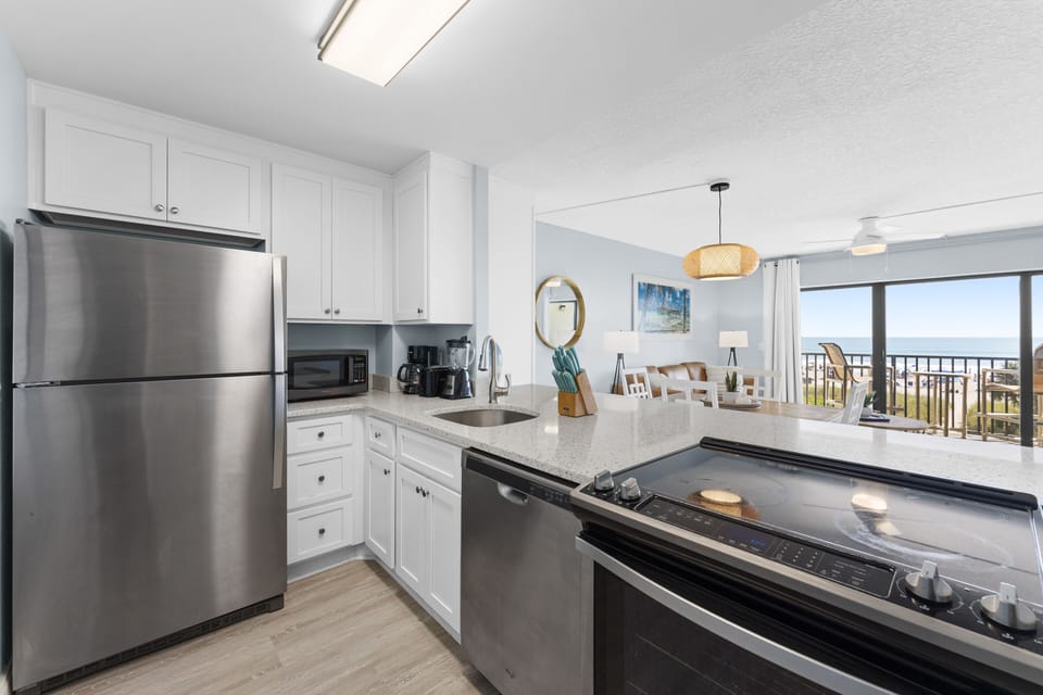 Sleek kitchen with stainless steel appliances and an open-concept design.