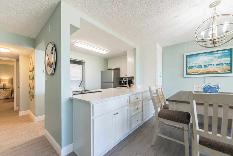 Bright open kitchen with sleek countertops and a spacious dining area
