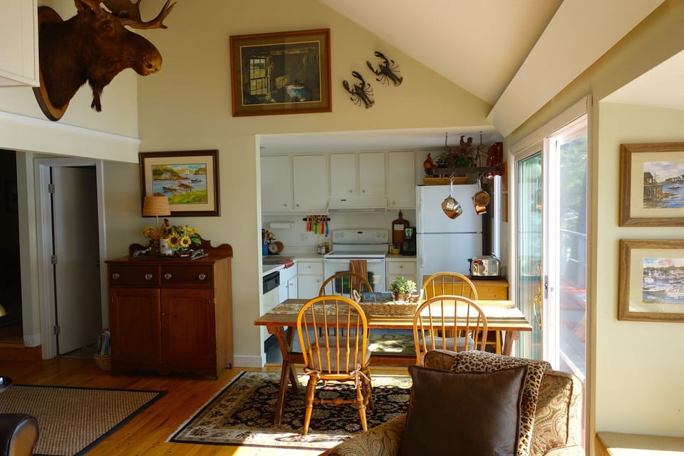 Efficient, well stocked kitchen and water view dining area