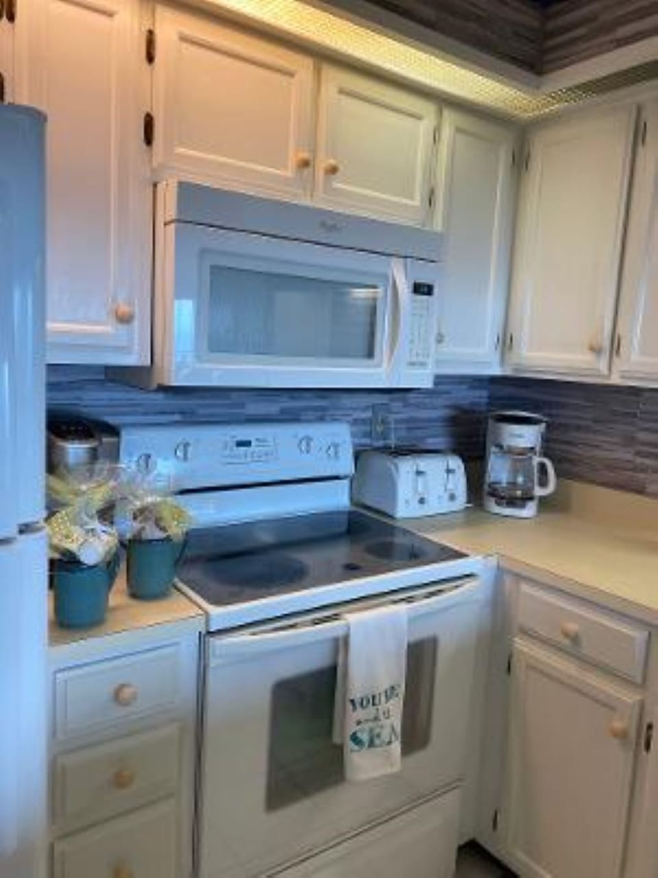 The kitchen is well stocked with both a drip and a Keurig coffee maker.