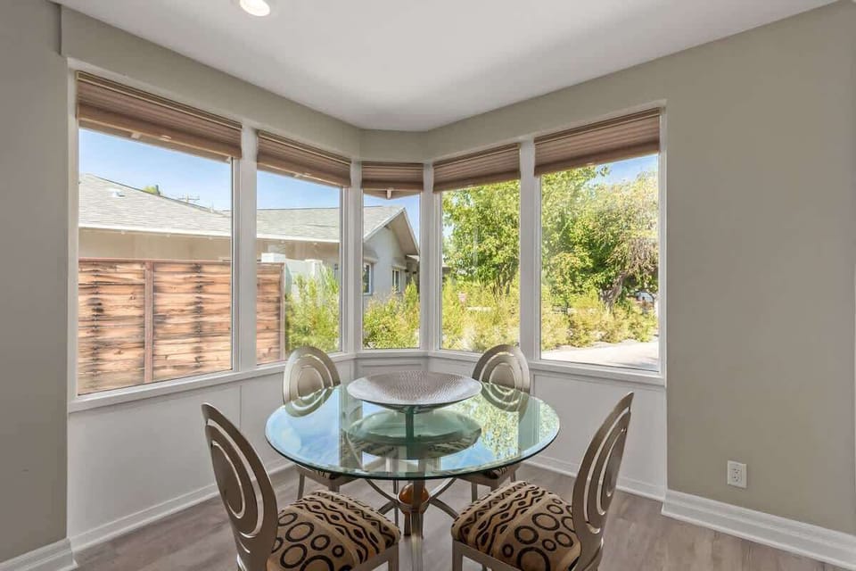 Dining table set to accommodate up to four guests.