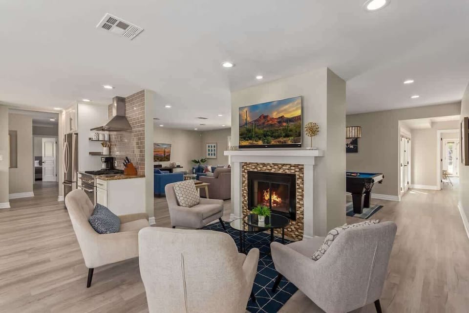 Lounge area off the kitchen featuring a cozy fireplace, and a Smart TV.