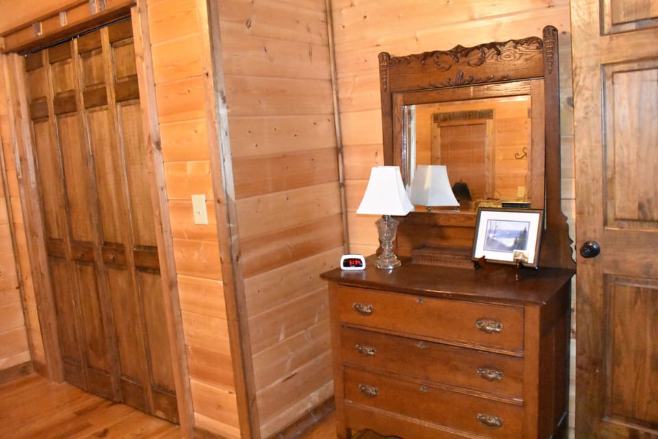Main floor bedroom has dresser and recently added 42-inch TV.
