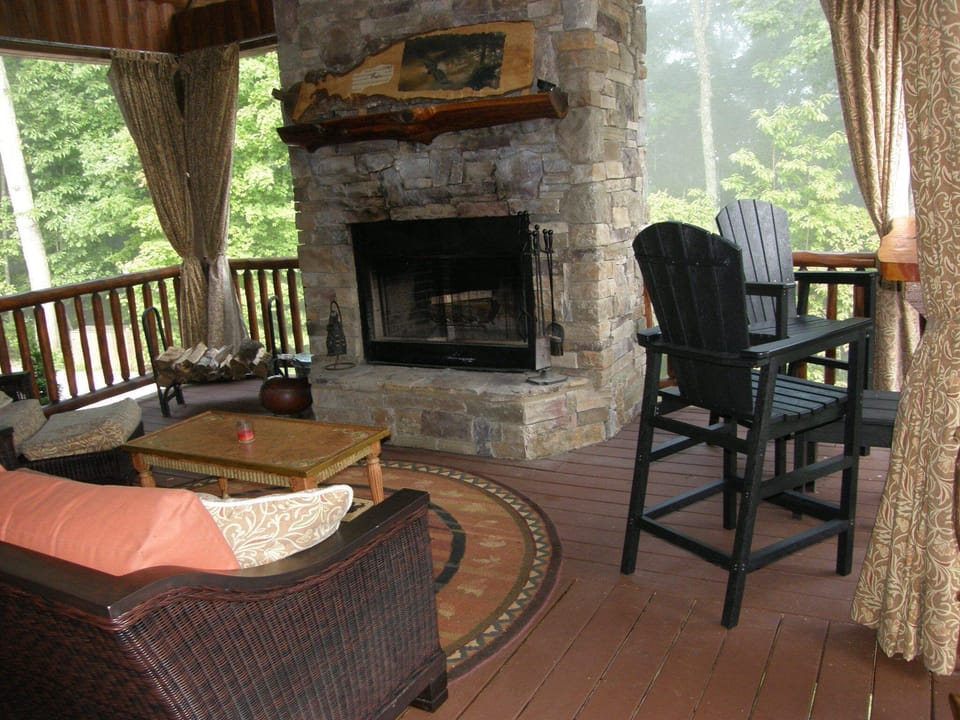 Fireplace deck with deep seating and bar height chairs for viewing
