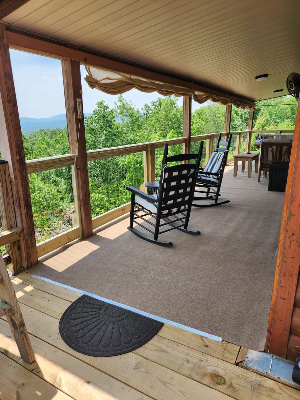 Covered porch for relaxing while enjoying the view.