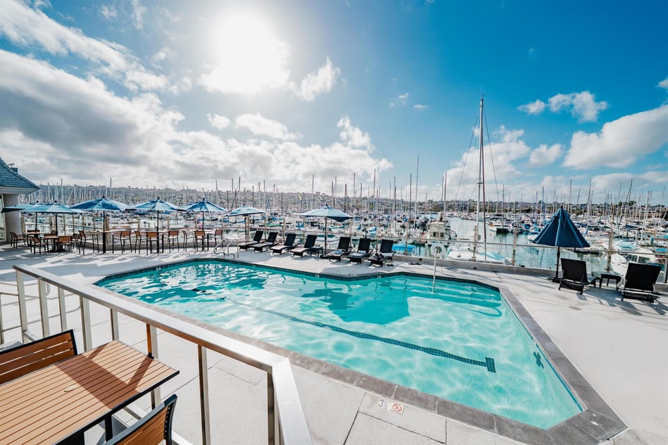 Outdoor pool, open 7:00 AM to 10:00 PM, pool umbrellas, sun loungers