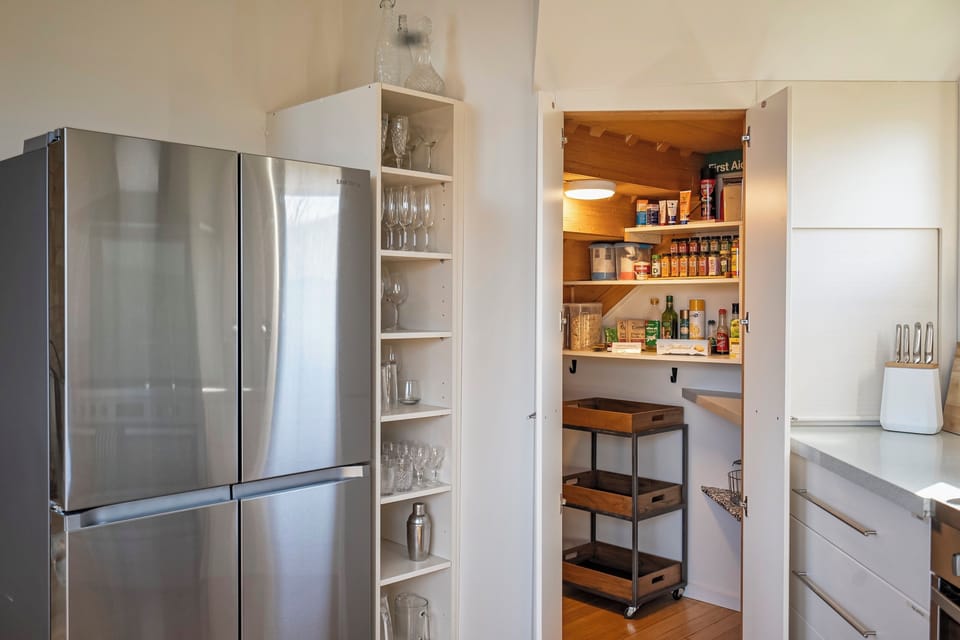 Modern french door refrigerator and freezer.  Large walk in pantry.