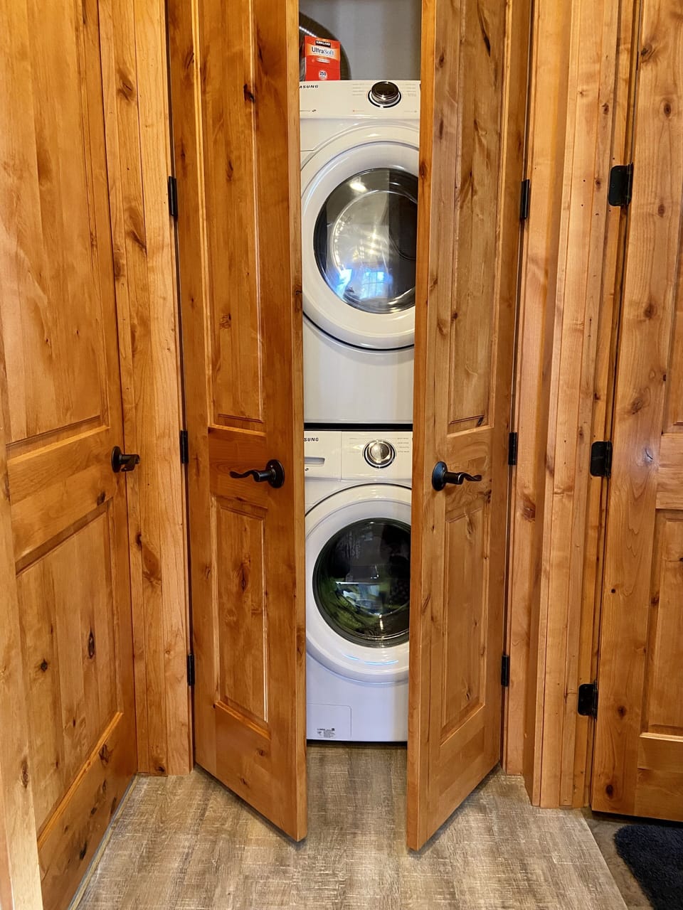 Washer and dryer at end of downstairs hall