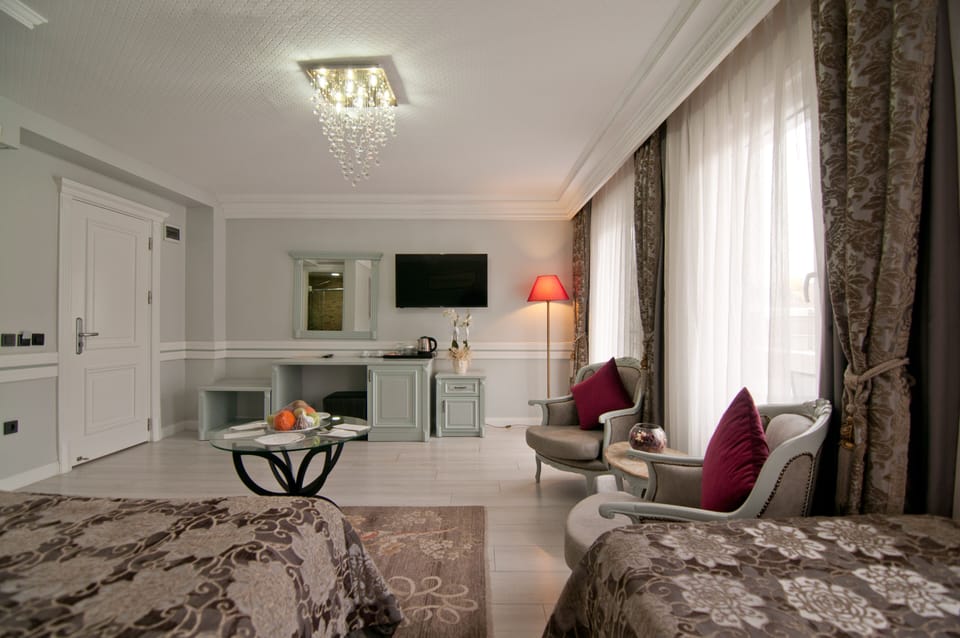 Suite, Balcony, Sea View | Premium bedding, minibar, in-room safe, individually decorated