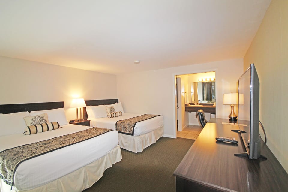 Standard Room, 2 Queen Beds | Travel crib, free WiFi, bed sheets