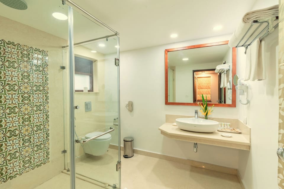 Shower, designer toiletries, hair dryer, bathrobes
