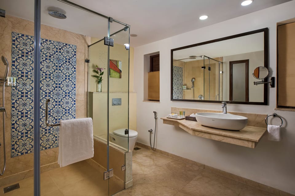 Shower, designer toiletries, hair dryer, bathrobes