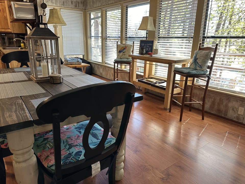Upstairs dining area. Table has 4 chairs and a bench.