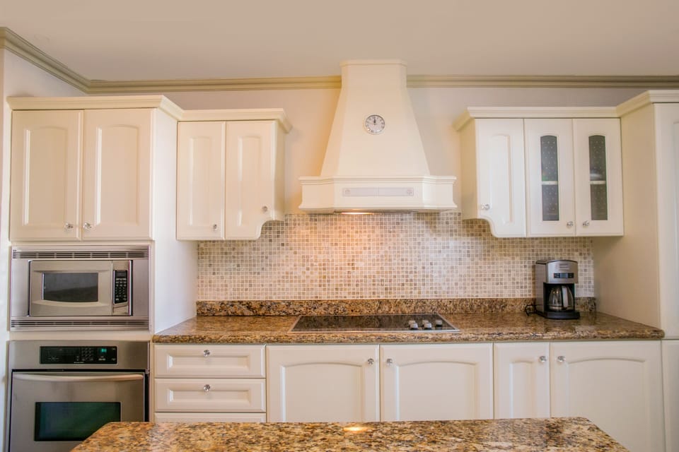 The high-end spacious kitchen which closes off from the dining area for privacy.
