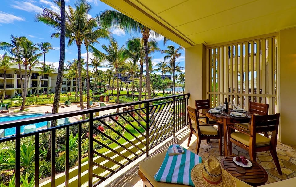 View of the pool and beach from the lanai