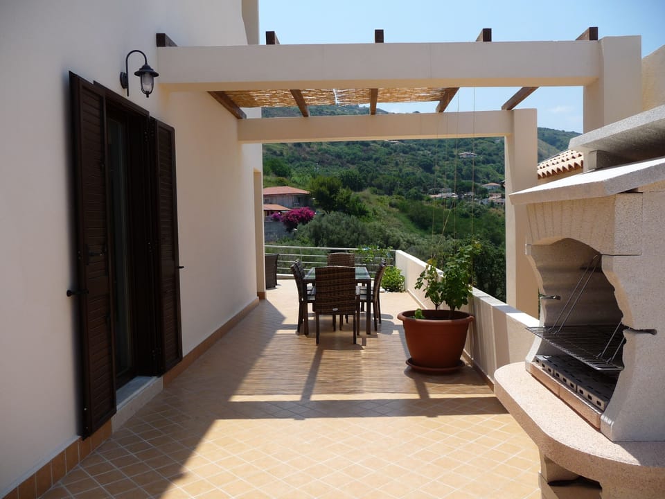 Pergola in the garden with charcoal barbeque