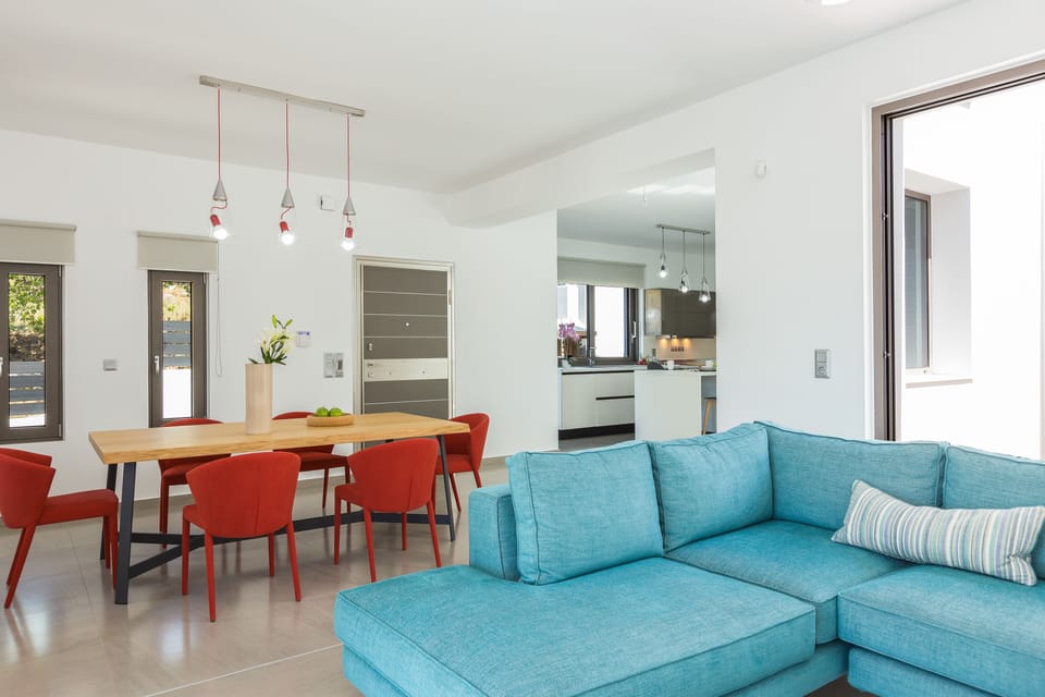 The living room area offers direct access to the pool and terrace!