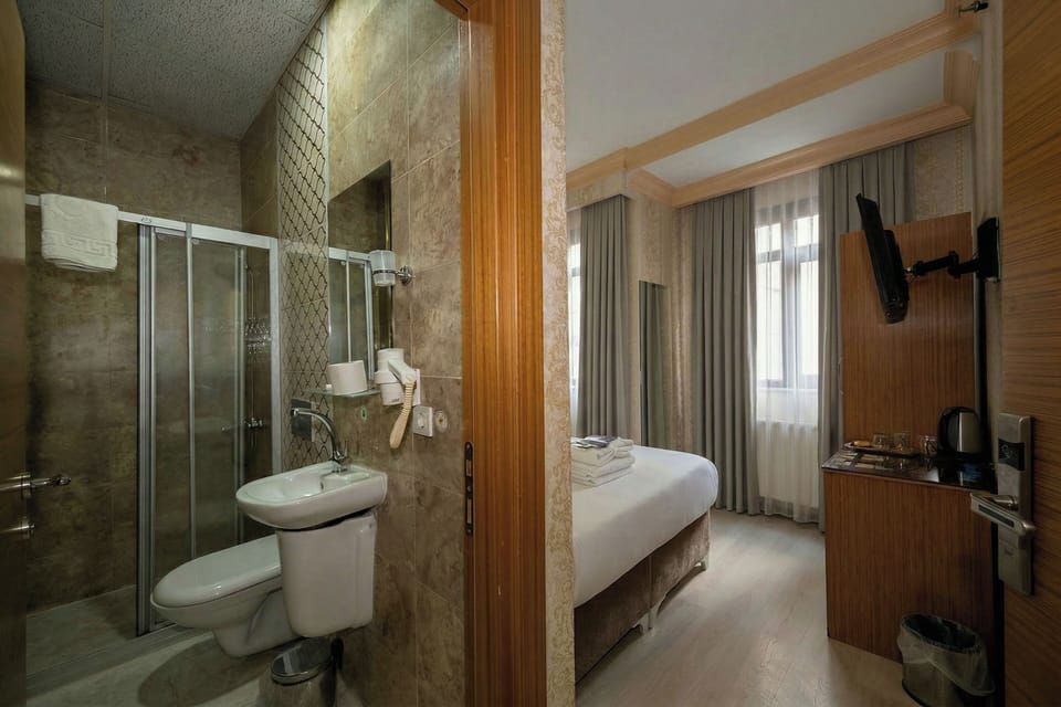 Shower, free toiletries, hair dryer, slippers