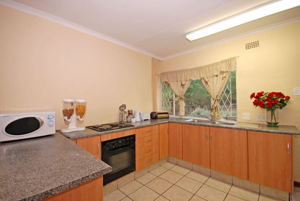 Dove family self-catering garden cottage | Private kitchen | Fridge, microwave, electric kettle, toaster