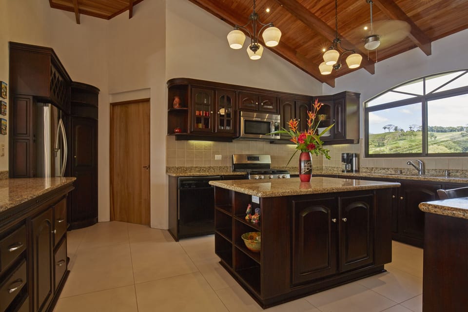 Spacious chef’s kitchen with granite island and premium appliances