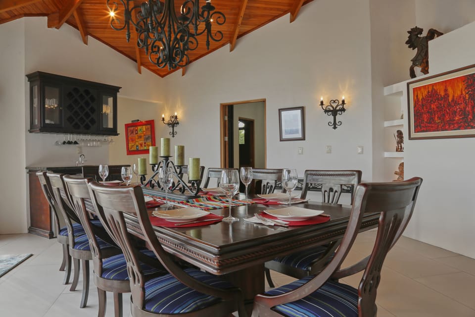 Enjoy memorable meals at the beautifully set dining table with bar access