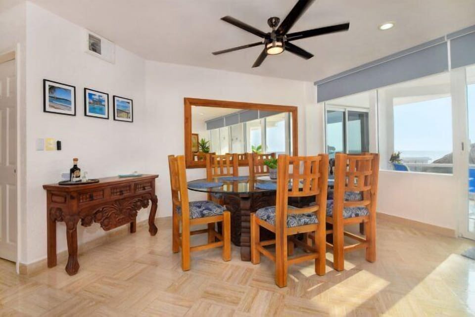 The lovely dining area with full sight lines to the living room and kitchen