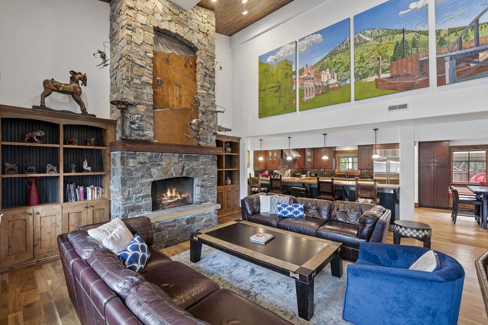 Great room and fireplace- gift card if you tell us what the mantle art piece is!