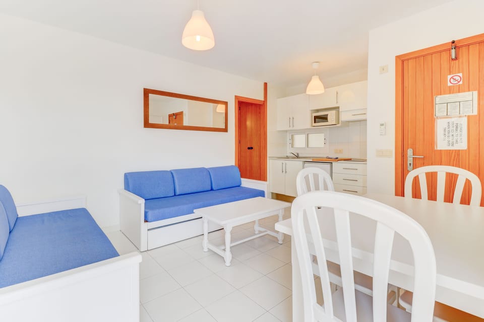 Apartment, 1 Bedroom, Balcony | Living area | Flat-screen TV