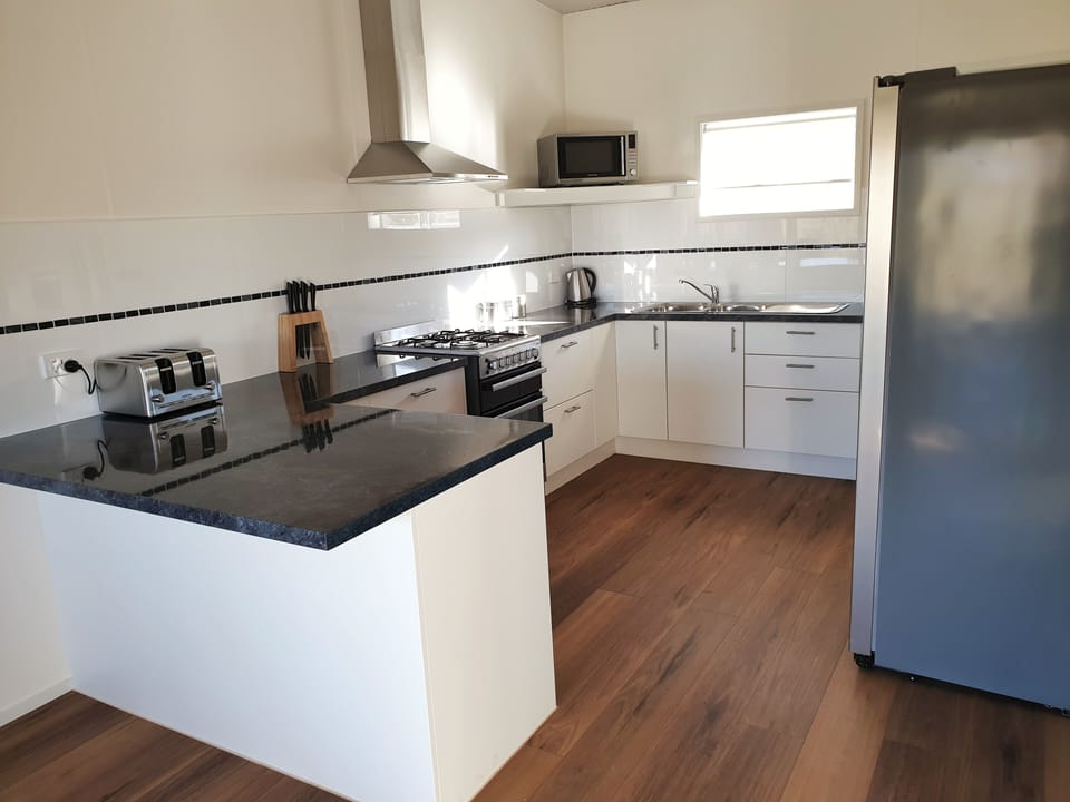 The Stockman's Lodge | Private kitchen | Microwave, stovetop, electric kettle, highchair